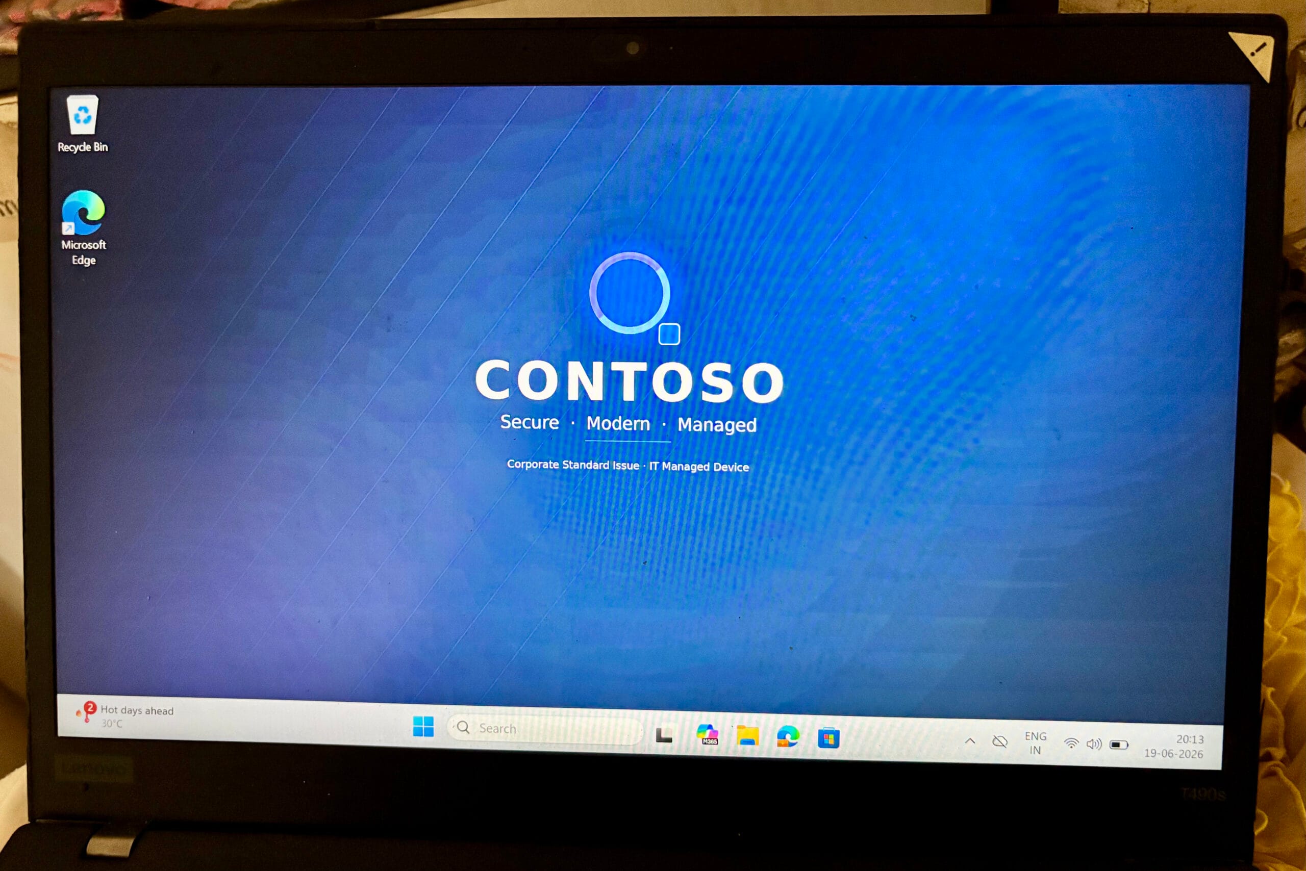 Windows desktop showing the corporate wallpaper applied successfully through Microsoft Intune