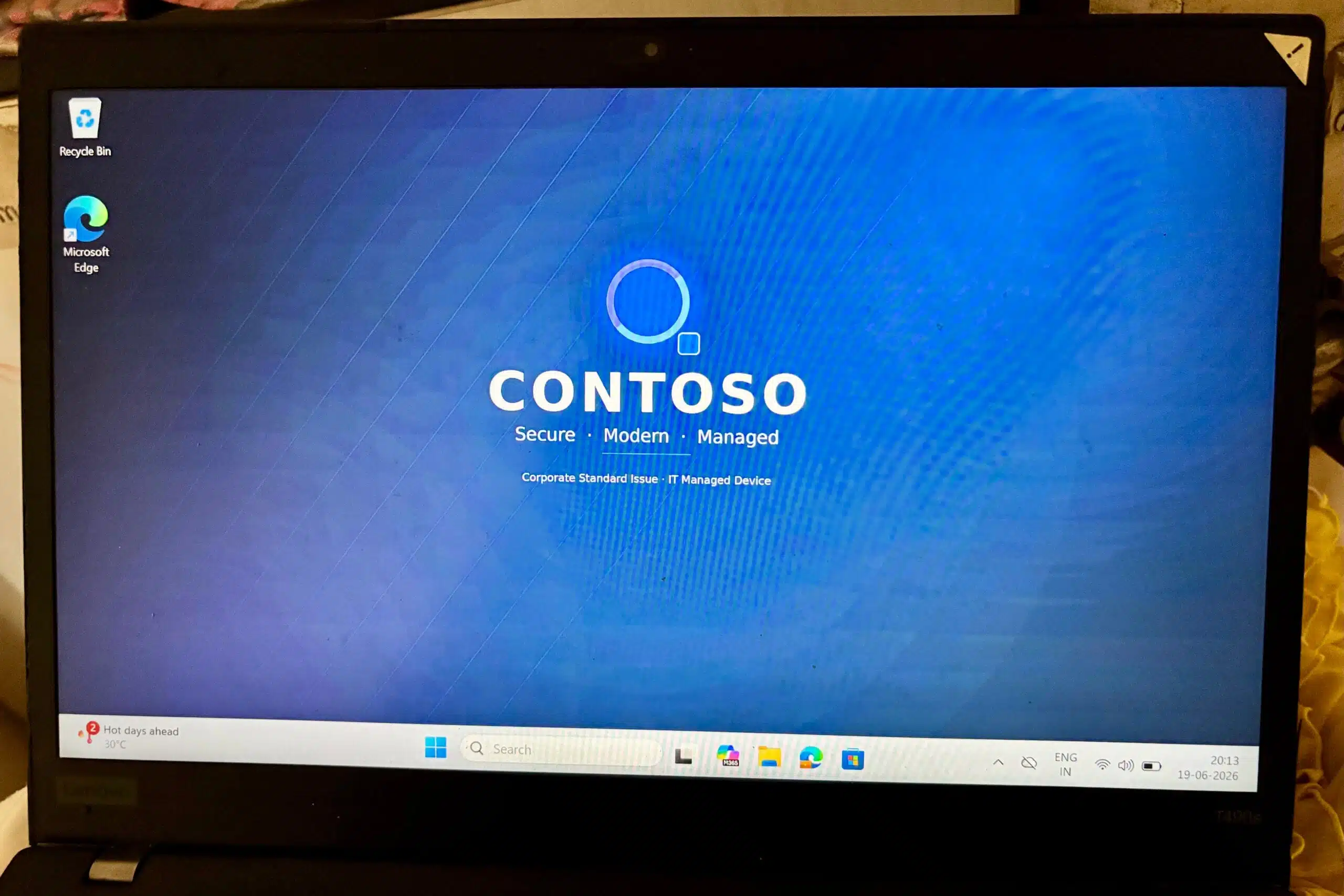 Windows desktop showing the corporate wallpaper applied successfully through Microsoft Intune